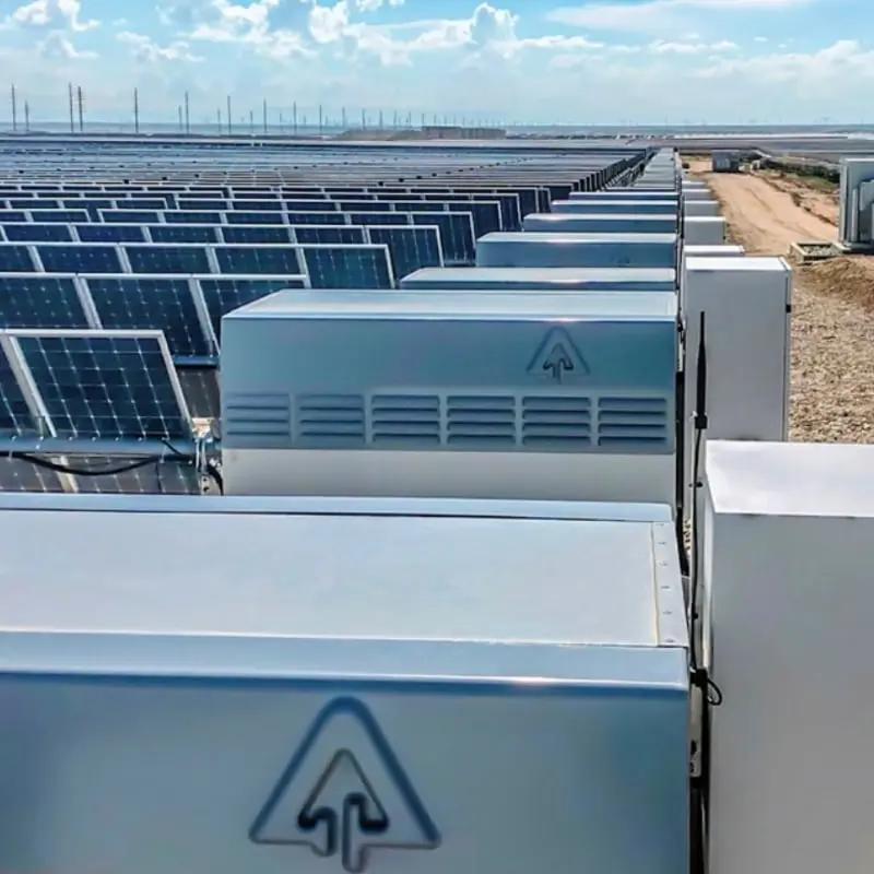 Battery storage units beside a solar array